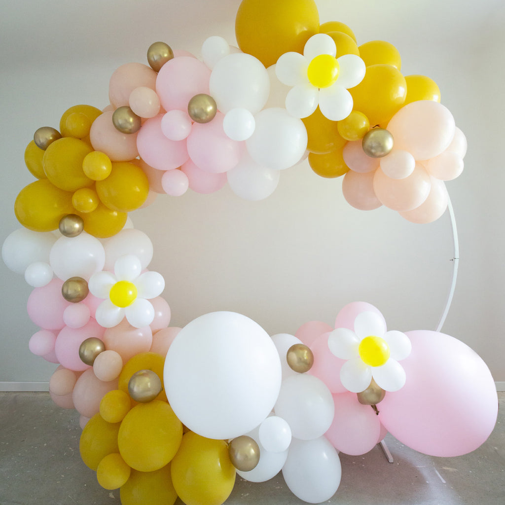 Daisy balloon flowers on balloon Garland. Pink, white, yellow balloons and daisy.